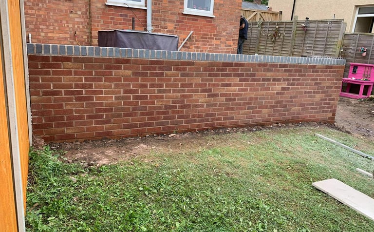 Solid brick boundary wall in Worcester residential property