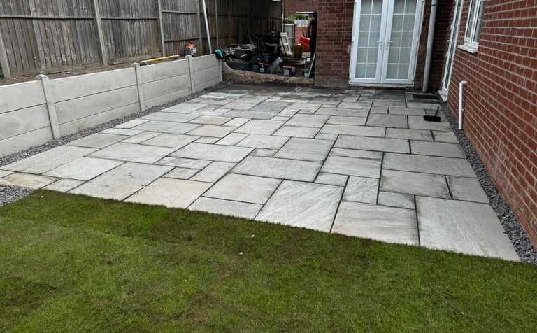 Neat and level slabbing work in Worcester garden by B R Building and Landscapes        Ask ChatGPT