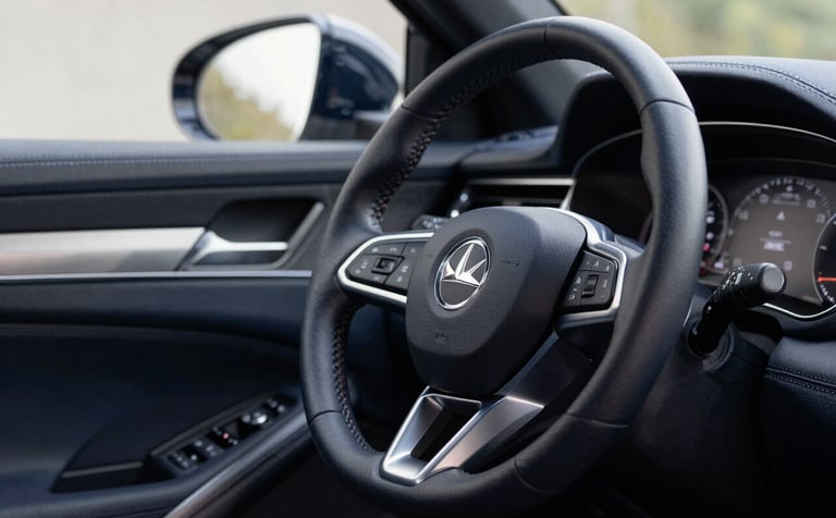 A close-up, high-end photograph of a luxury car steering wheel and leather dashboard, dark navy blue interior with subtle metallic silver accents, soft natural lighting, professional automotive photography style.