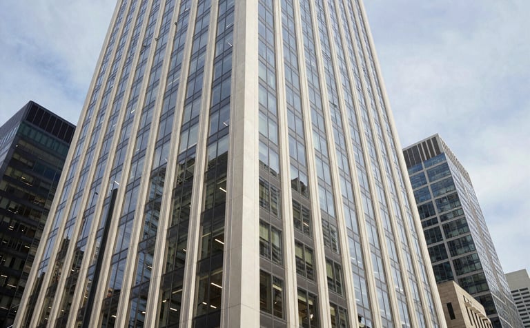A wide-angle shot of a collaborative environment in a North American US skyscraper. The setting is clean and futuristic with glass walls, featuring a palette of off-white and steel blue.