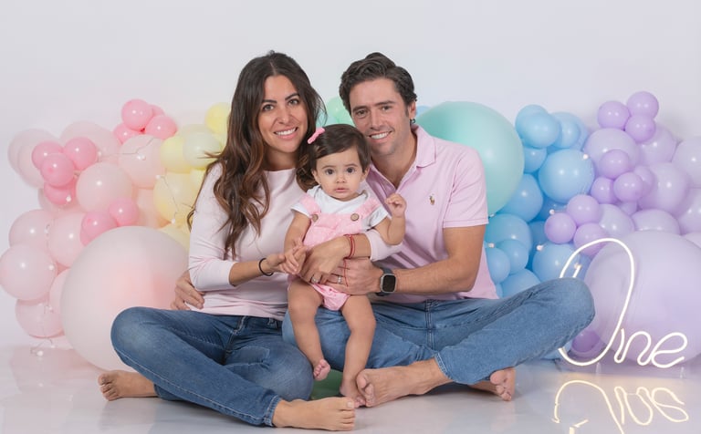 a baby boy in a circus themed birthday party