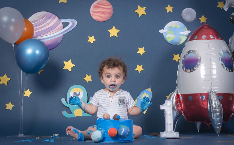 a baby boy in a space themed photo shoot