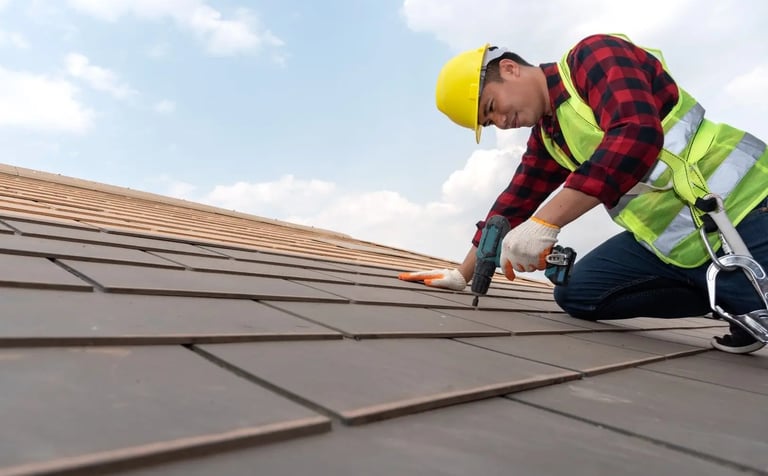 a roof worker is using a drill to fix the roof