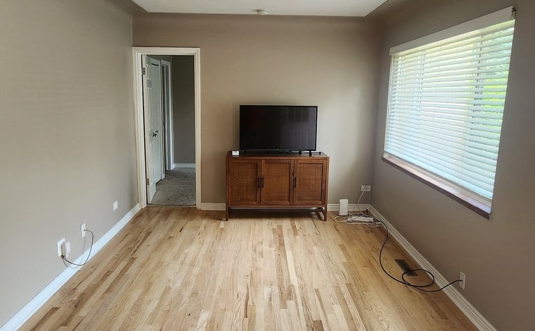 Professional interior home painting in the Denver Metro area featuring clean lines and neutral wall 