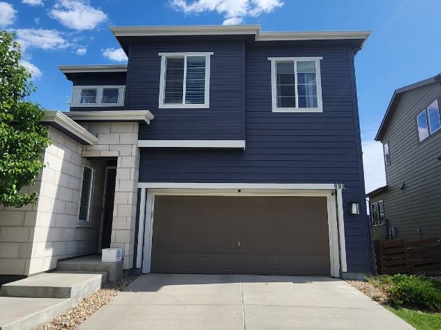 Premium exterior house painting on modern siding and stone masonry by Denver Metro's expert painters