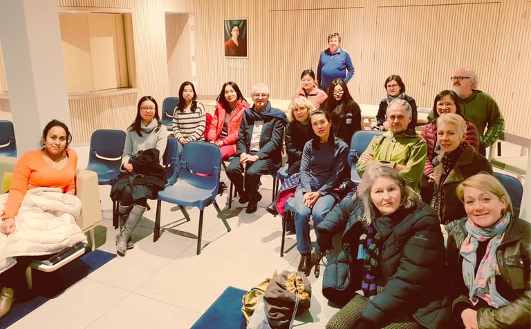 Group of attendees at Auckland International Film Club participating in a post-screening discussion.