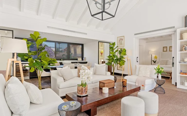 Bright open-plan living room with neutral décor and natural light at Villa El Olivo, Marbella