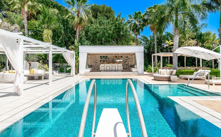 Pool area at Villa Serenity featuring modern furnishings, sunbathing lounges, and chill-out areas