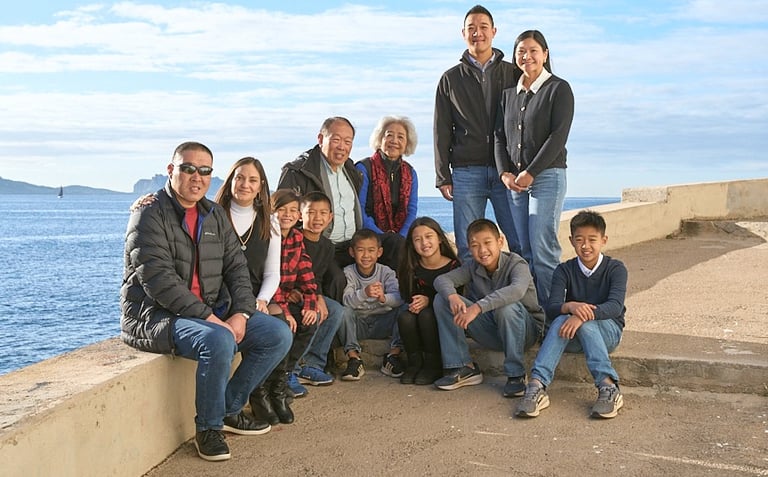 Family portrait along the Vieux Port of Marseille with seaside background