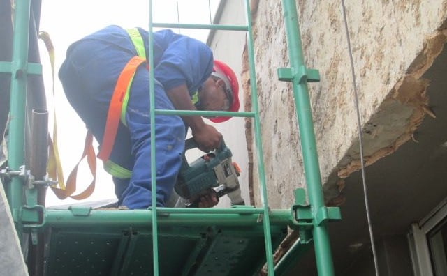 Mechanical stripping of compromised exterior plaster for waterproofing works, Sandhurst Towers, Sandton