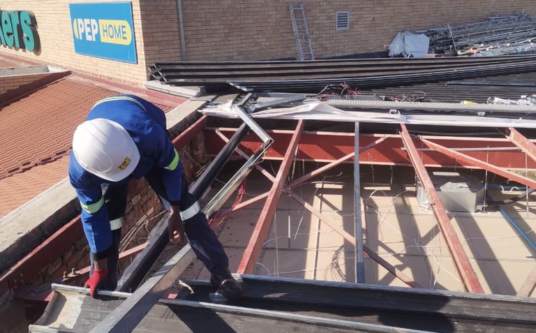 Environmental Pro Construction team replacing a roof structure on a commercial building in West Rand