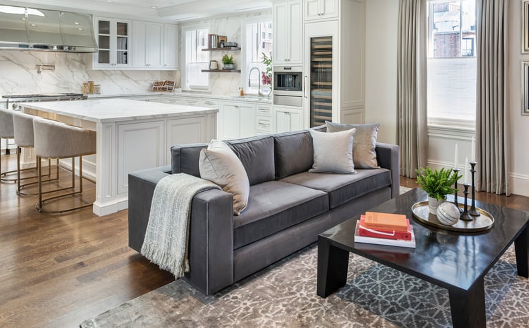 a living room with a couch and a table