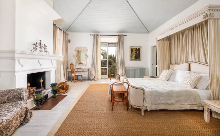 Master suite with fireplace at Finca Santa Katerina