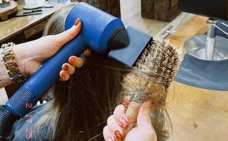blow drying with Dyson dryer at Meraki and Co salon and spa greer sc 
