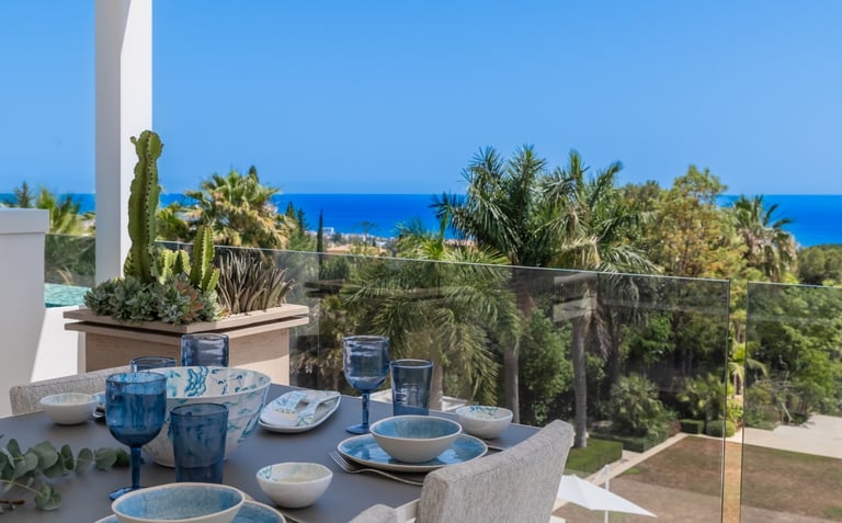 Rooftop dining area with sea views at Villa Serenity