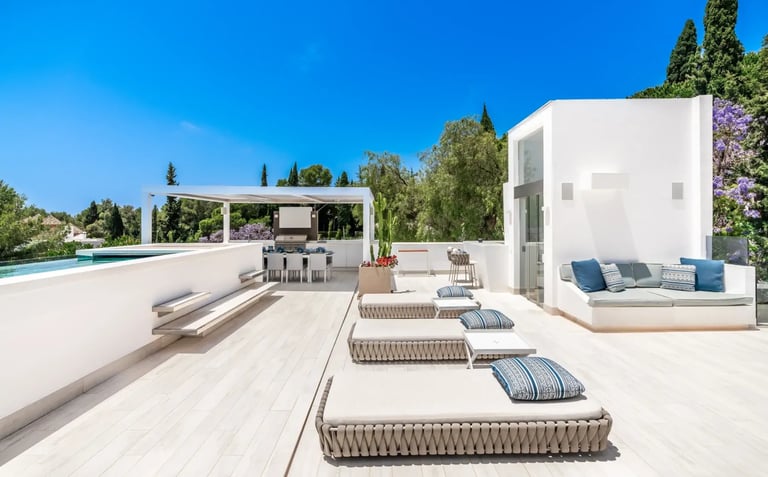 Villa Serenity rooftop with loungers and sweeping sea views