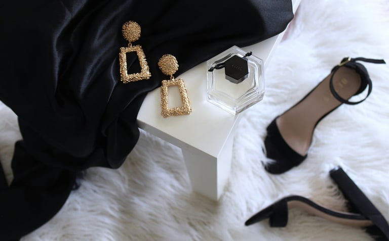 beauty-accessories-on-the-table-with-heels-on-floor