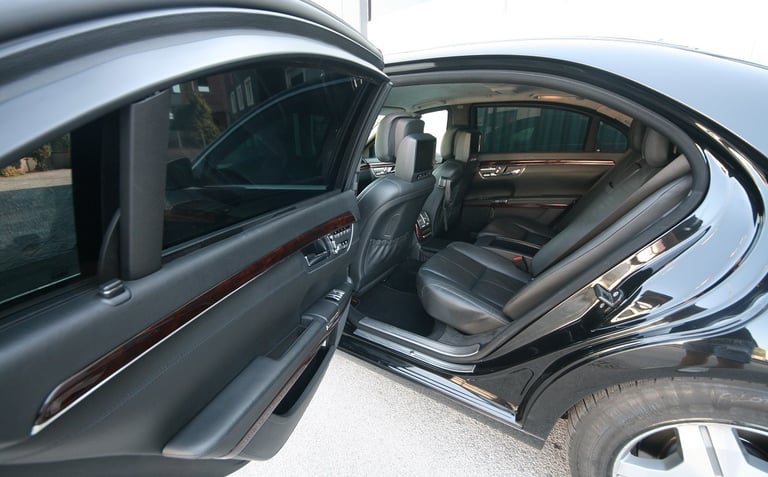 Interior and open door of VR10 armored vehicle, showcasing luxury and maximum ballistic protection.