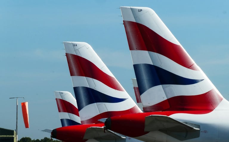 British Airways planes' tails visible in airport