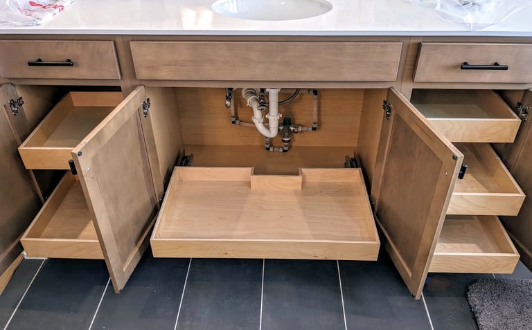 Pull outs for shelves installed in a bathroom vanity.