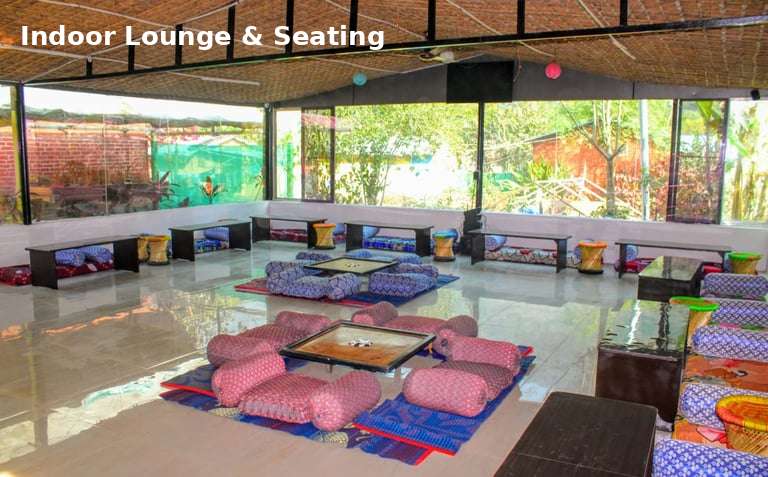 indoor lounge area at Jungle Lore Resort with comfortable seating and group space