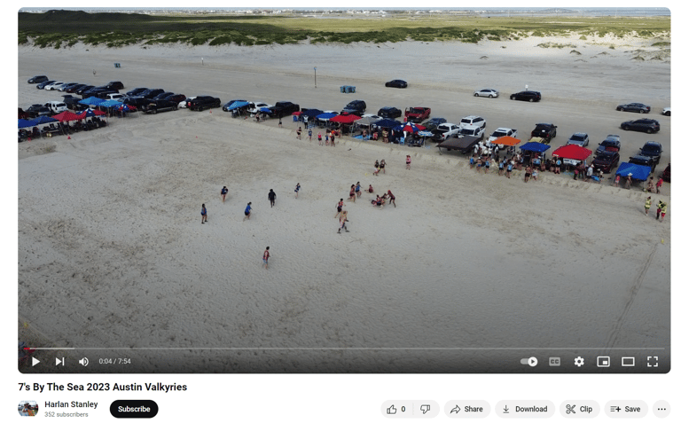 a group of people standing on a beach drone shot rugby rugby maul scrum lineout corpus christi