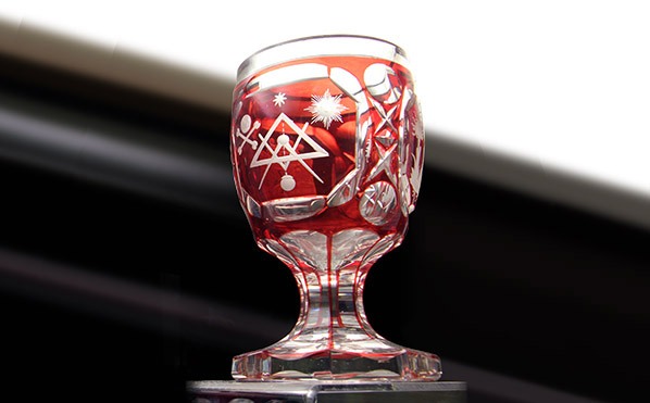 A crystal goblet with cut to clear Mason symbols