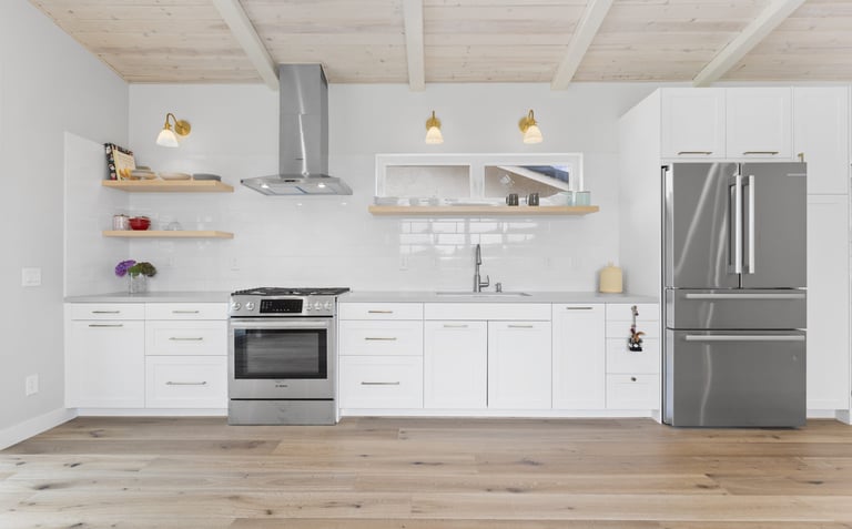 a kitchen with a refrigerator, stove, and a refrigerator