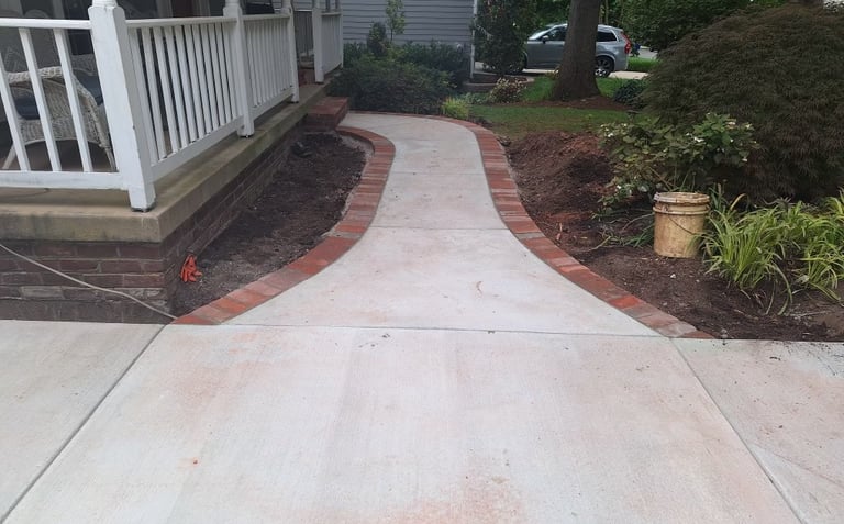 a walkway with a brick walkway and a brick walkway