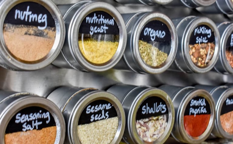 before and after small kitchen spice organization using magnetic spice jars and vertical spice racks
