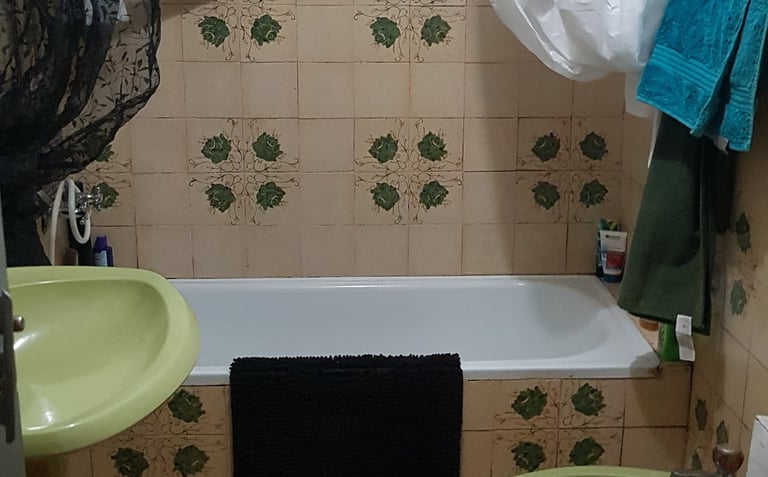 a bathroom with a bathtub and a toilet