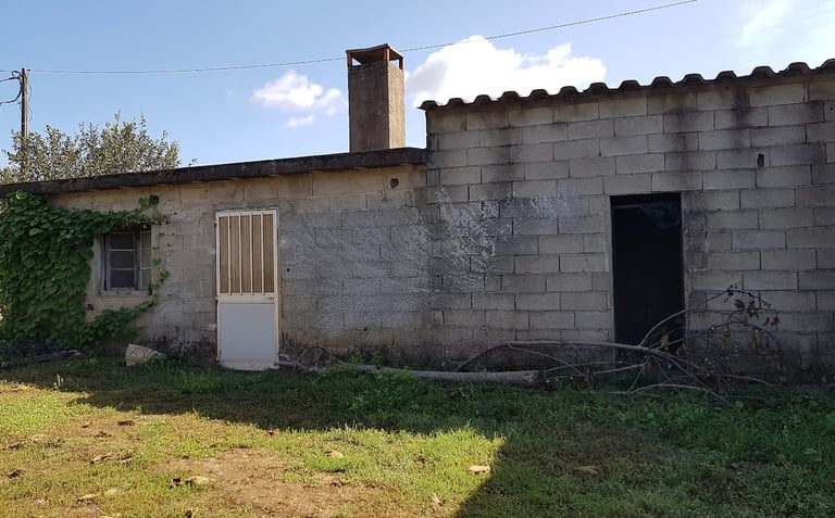 a house with a bicycle leaning against a wall