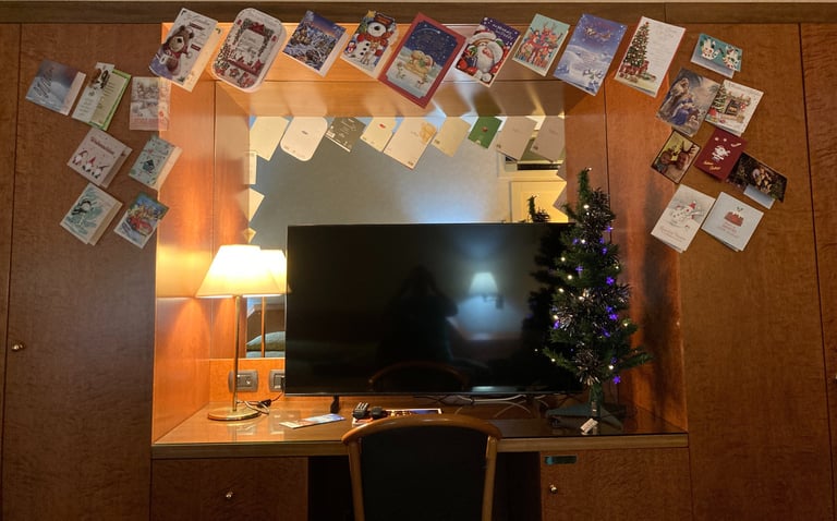 Hotel room in Grand Hotel San Marino, decorated with Christmas tree and cards 