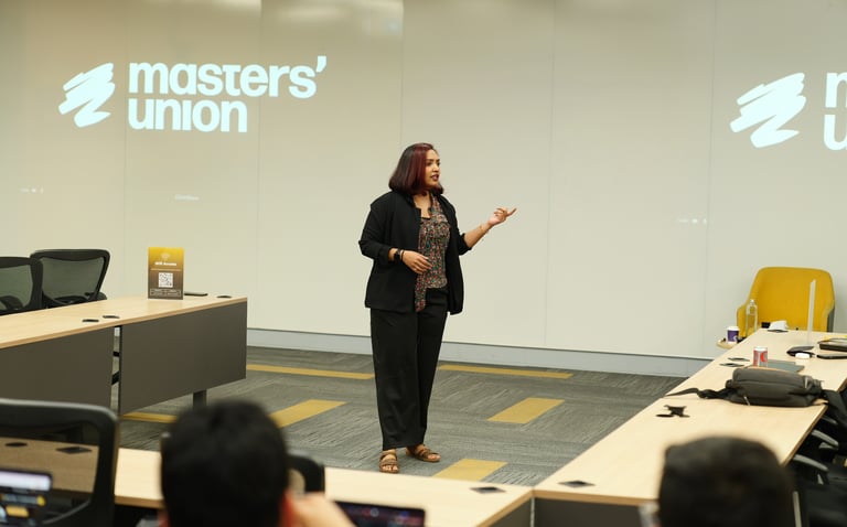 Eila Qureshi taking an in person workshop on building MVP using AI and no code tools