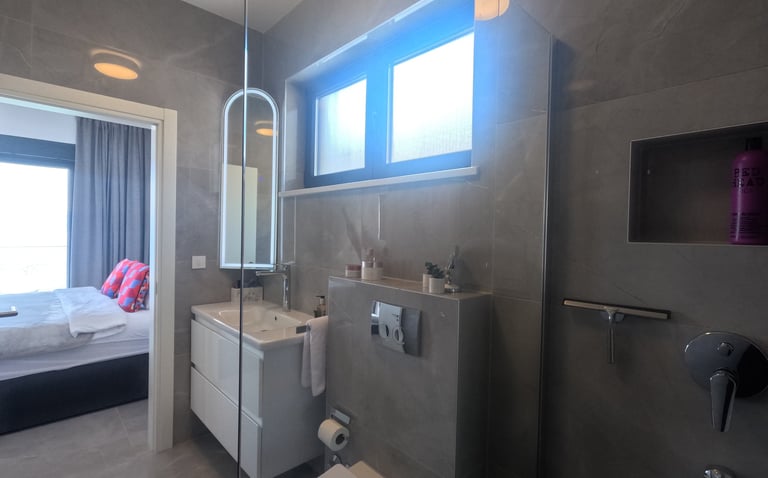 Villa Fay master bathroom with a toilet and a shower