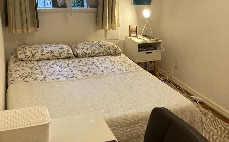 a bed room with a bed and a desk