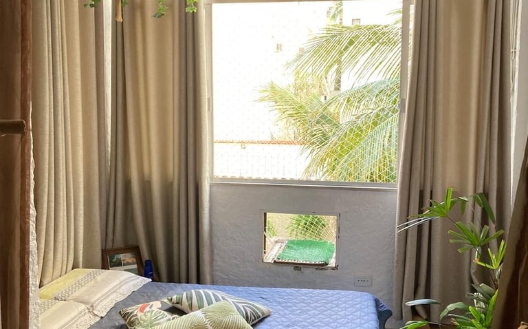 a bed room with a bed and a window