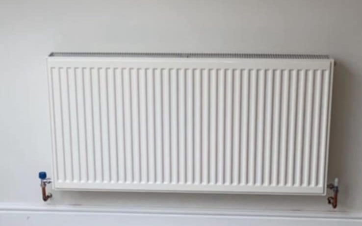 wall-mounted towel rail radiator installed by Gas Safe engineer in Evesham