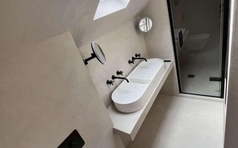 modern bathroom with freestanding bathtub and wall-mounted tap in Evesham