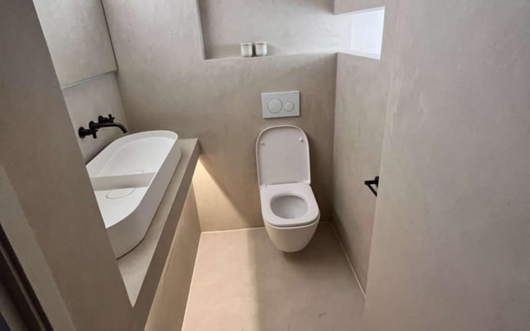 white ceramic toilet with matching sink in contemporary Pershore bathroom