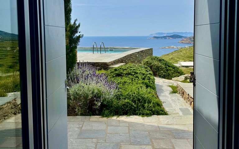 View out of one of the bedrooms over the pool onto the sea
