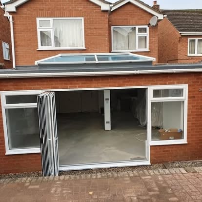 Rear home extension in Worcester with full-width patio doors