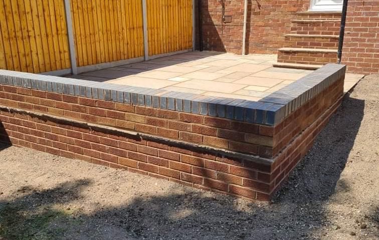 garden wall in the back of a worcester garden by B R Building and Landscapes