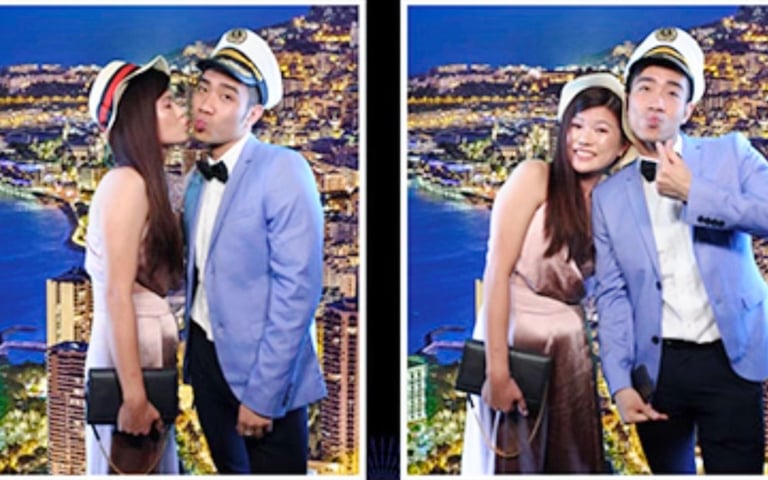 Couple posing with a Green Screen taken at a celebration Mirror Photo Booth.