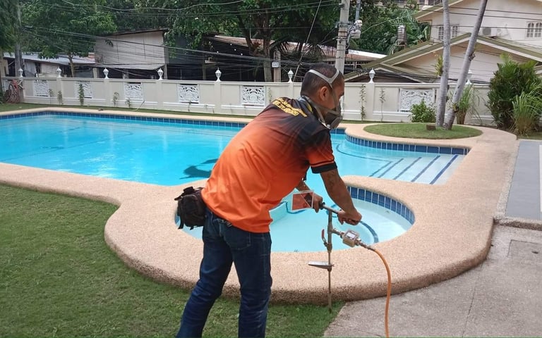 Siquijor pest control technician injecting soil treatment for termites, applying termiticide