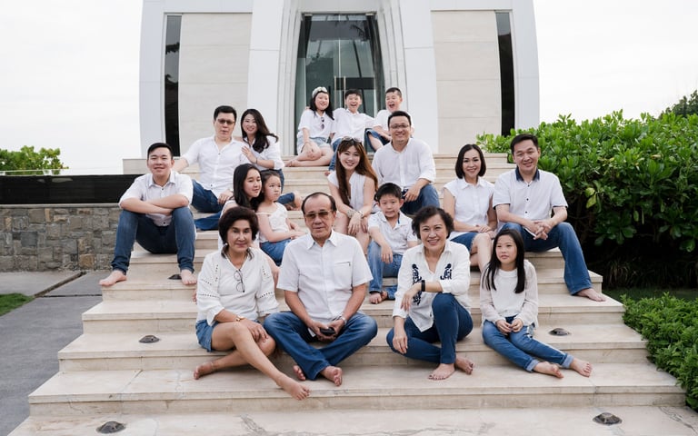 Large extended family portrait sitting together at The Ritz-Carlton Bali during a family photography session