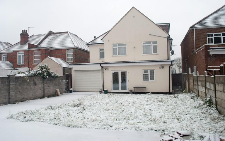 brick home extension with pitched roof in Evesham