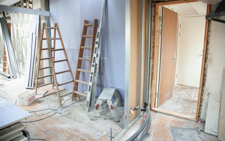 a room with ladders in being decorated in evesham