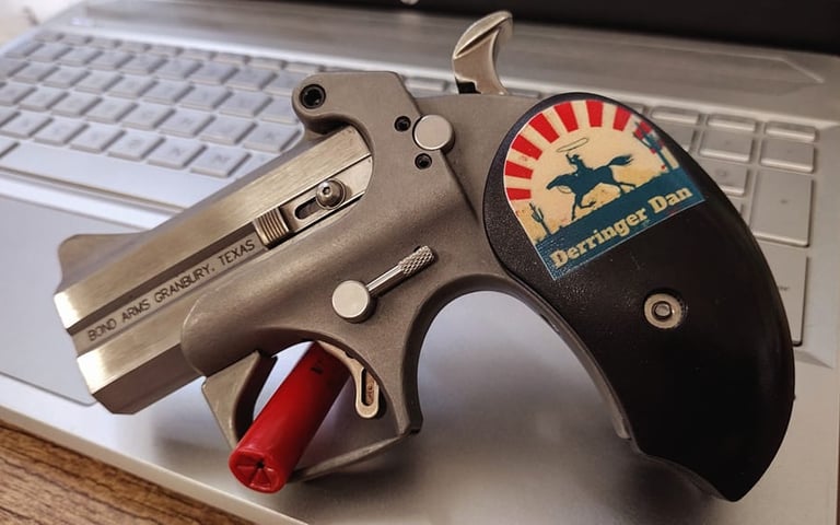 bond arms with Derringer Dan grip on a laptop