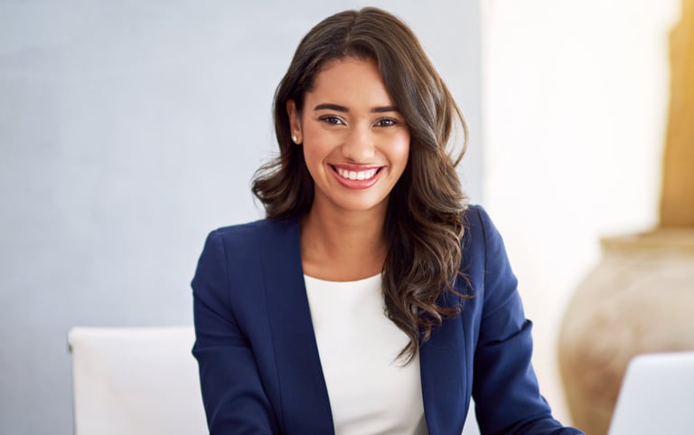 a woman in a blue jacket and white shirt